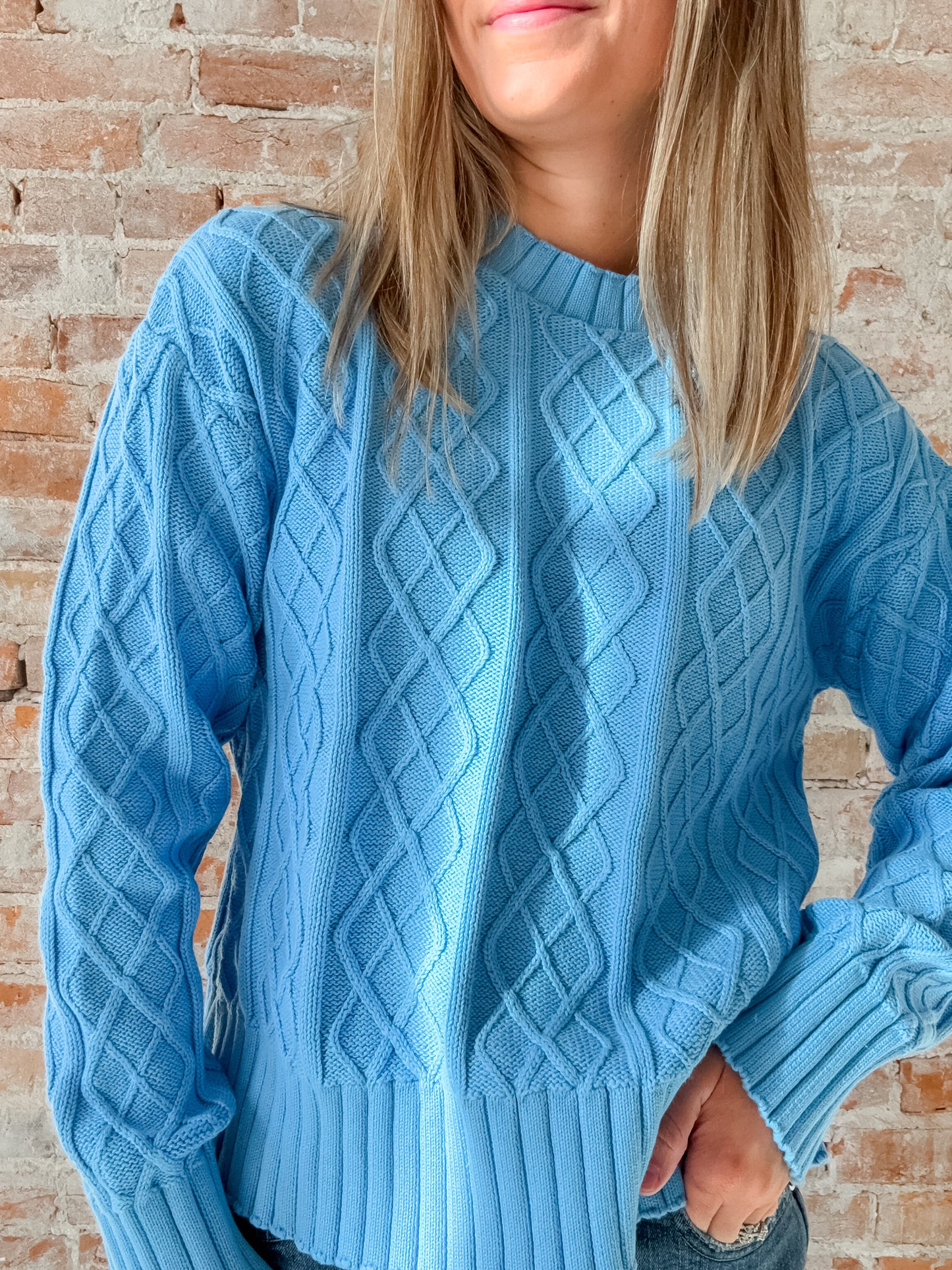 light blue cable knit sweater