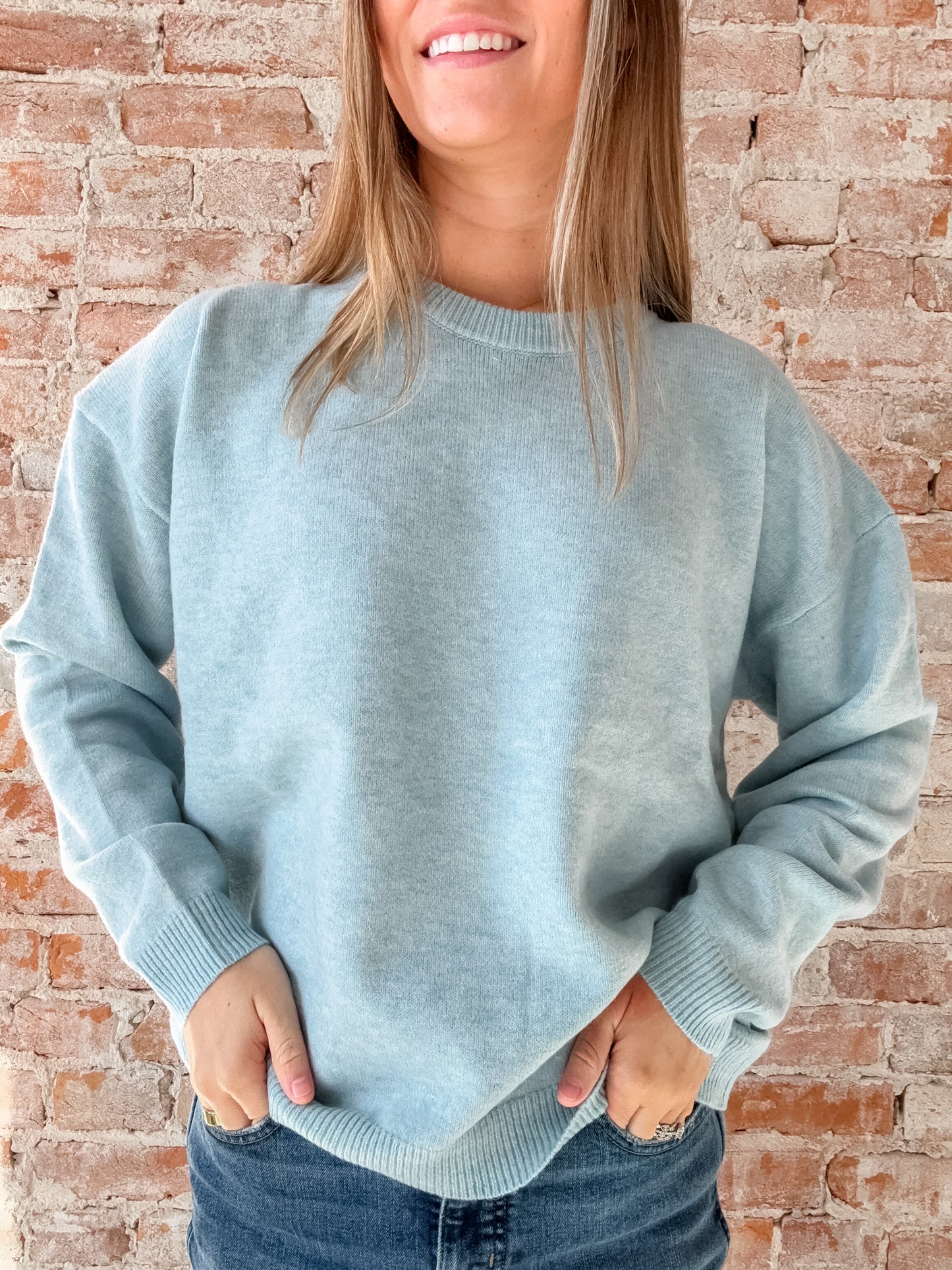 light blue sweater