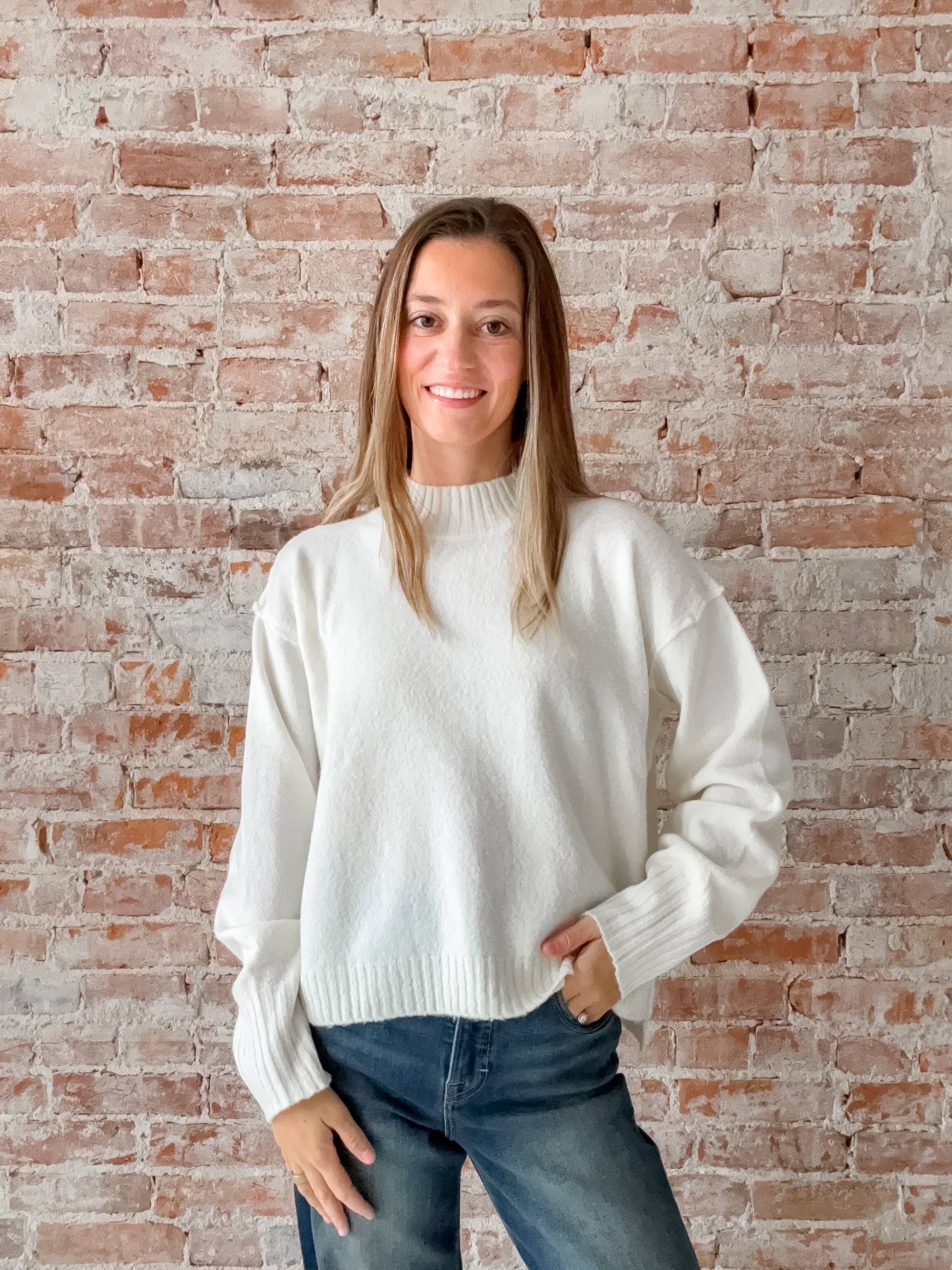 white mock neck sweater