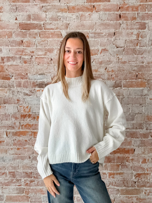 white mock neck sweater
