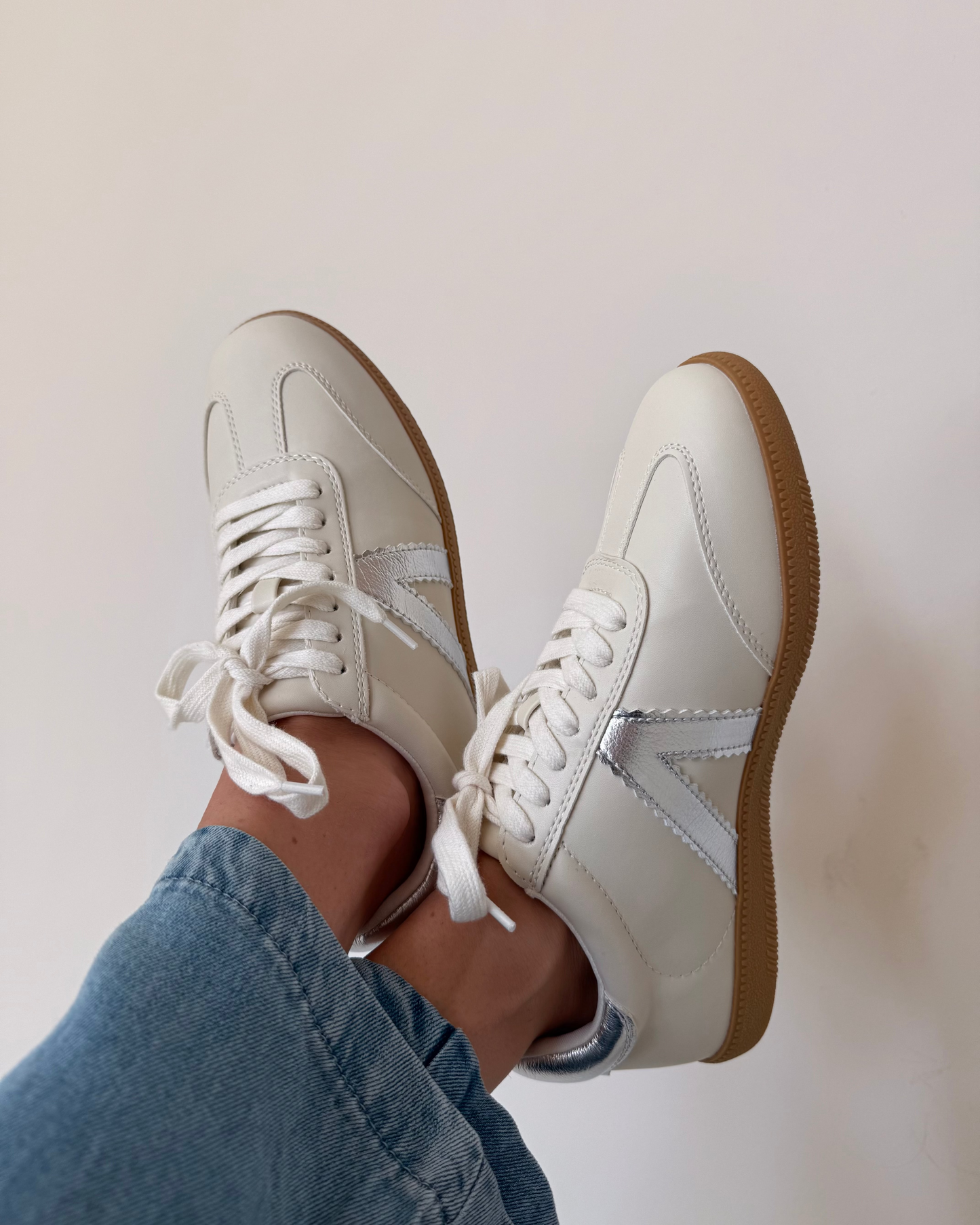 white sneaker with silver accents