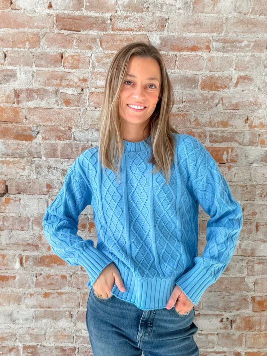 light blue cable knit sweater