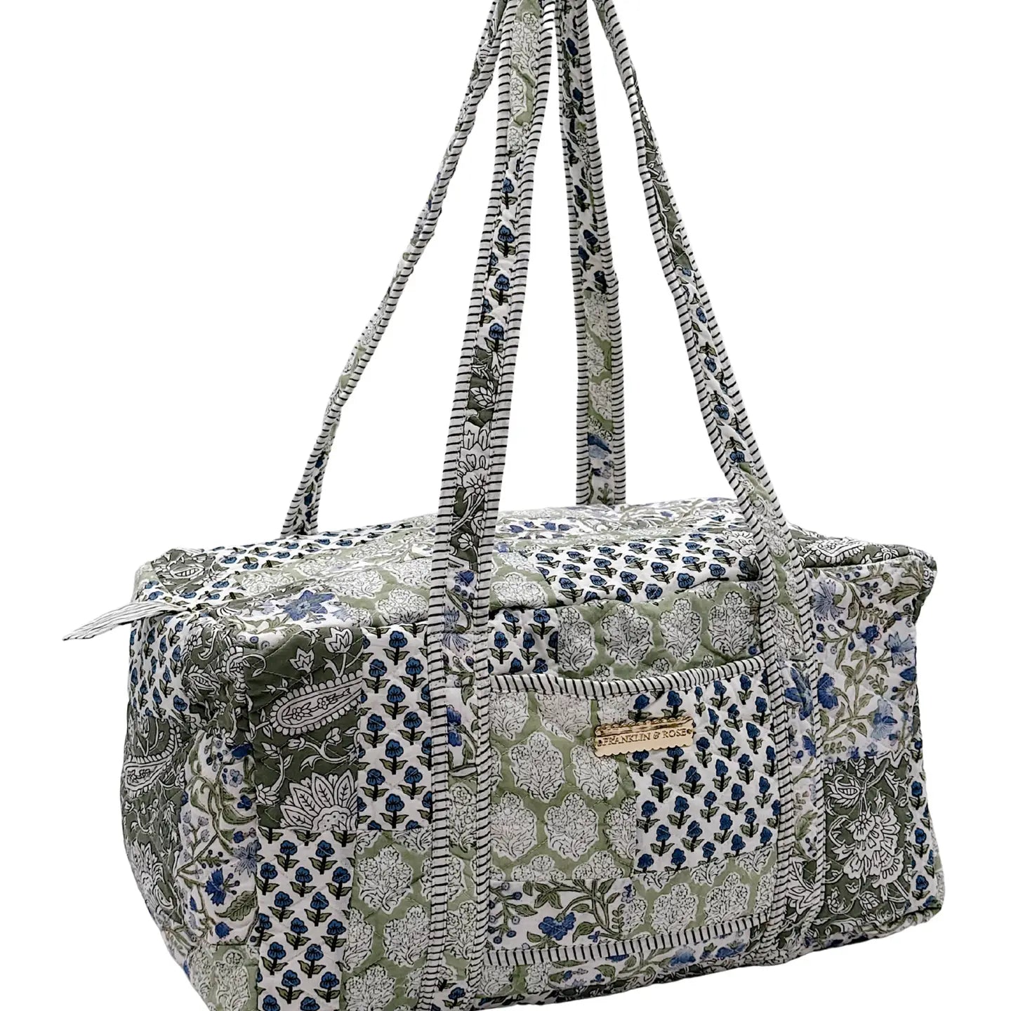 blue and green floral pattern duffle bag