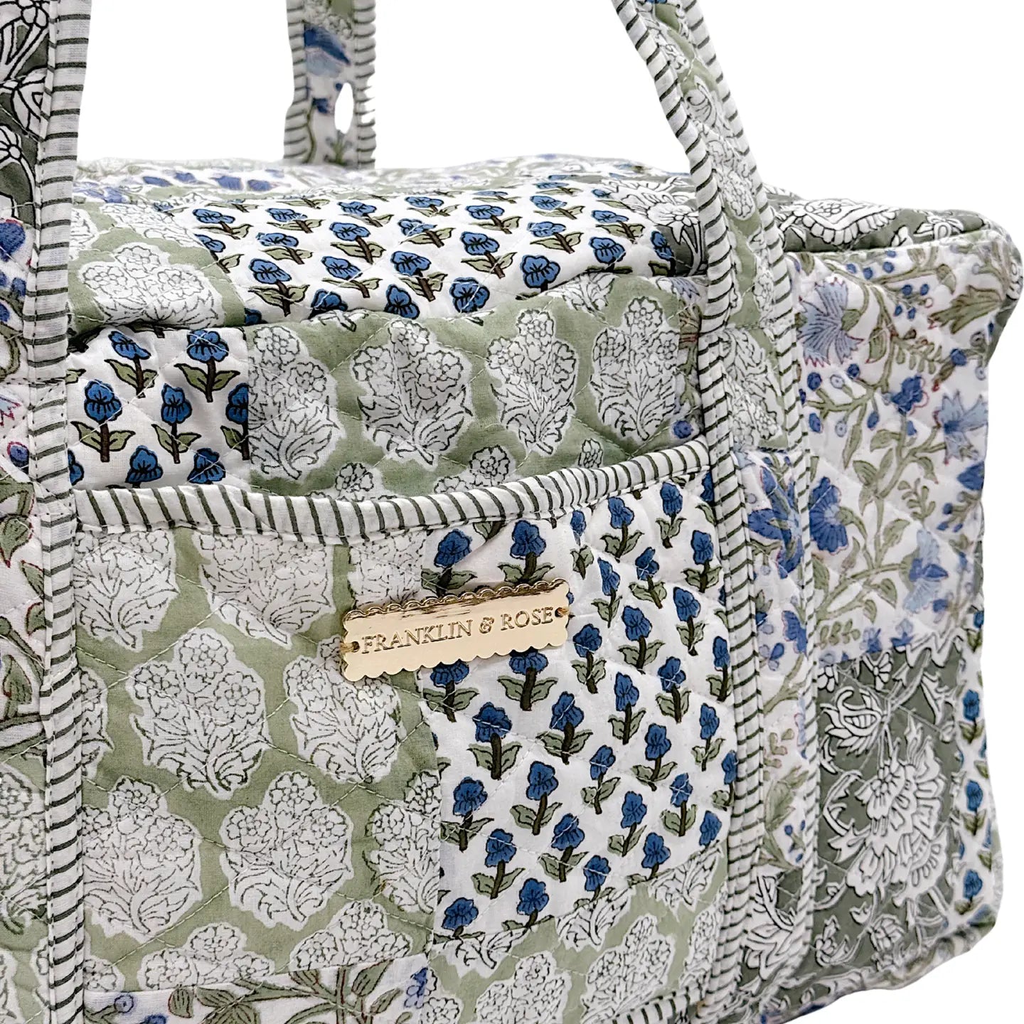 green and blue floral pattern duffle bag