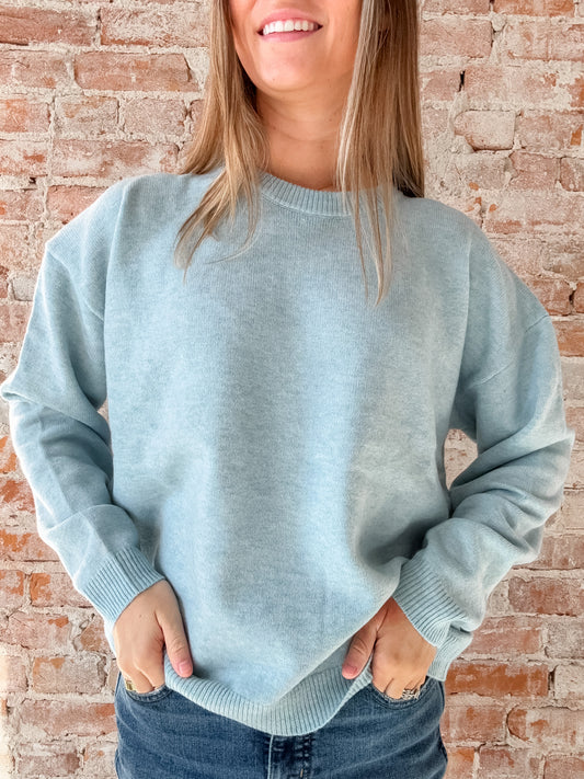 light blue sweater