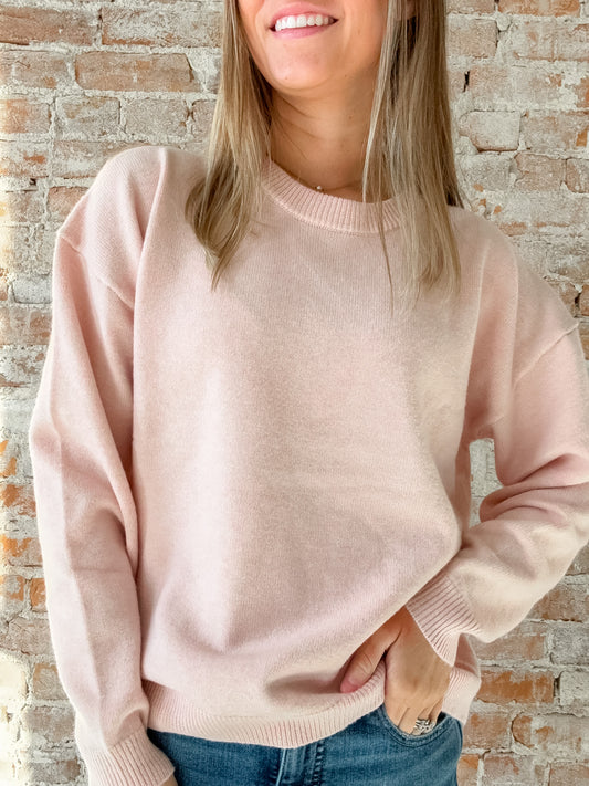 pink crewneck sweater