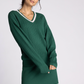 green v neck sweater with pink detailing