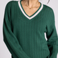 green v neck sweater with pink detailing
