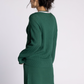 green v neck sweater with pink detailing
