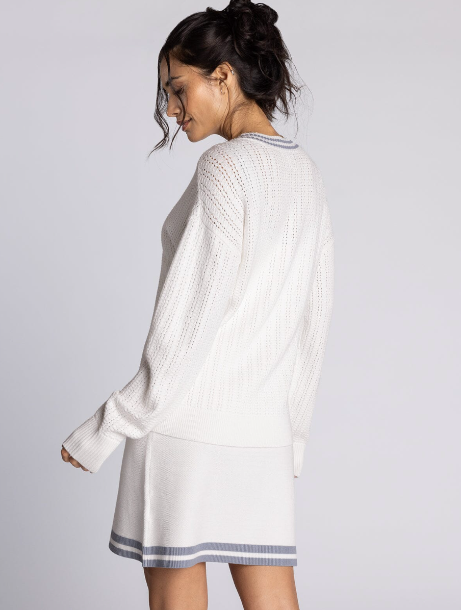 white v neck sweater with blue detailng