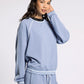 light blue crewneck athletic top