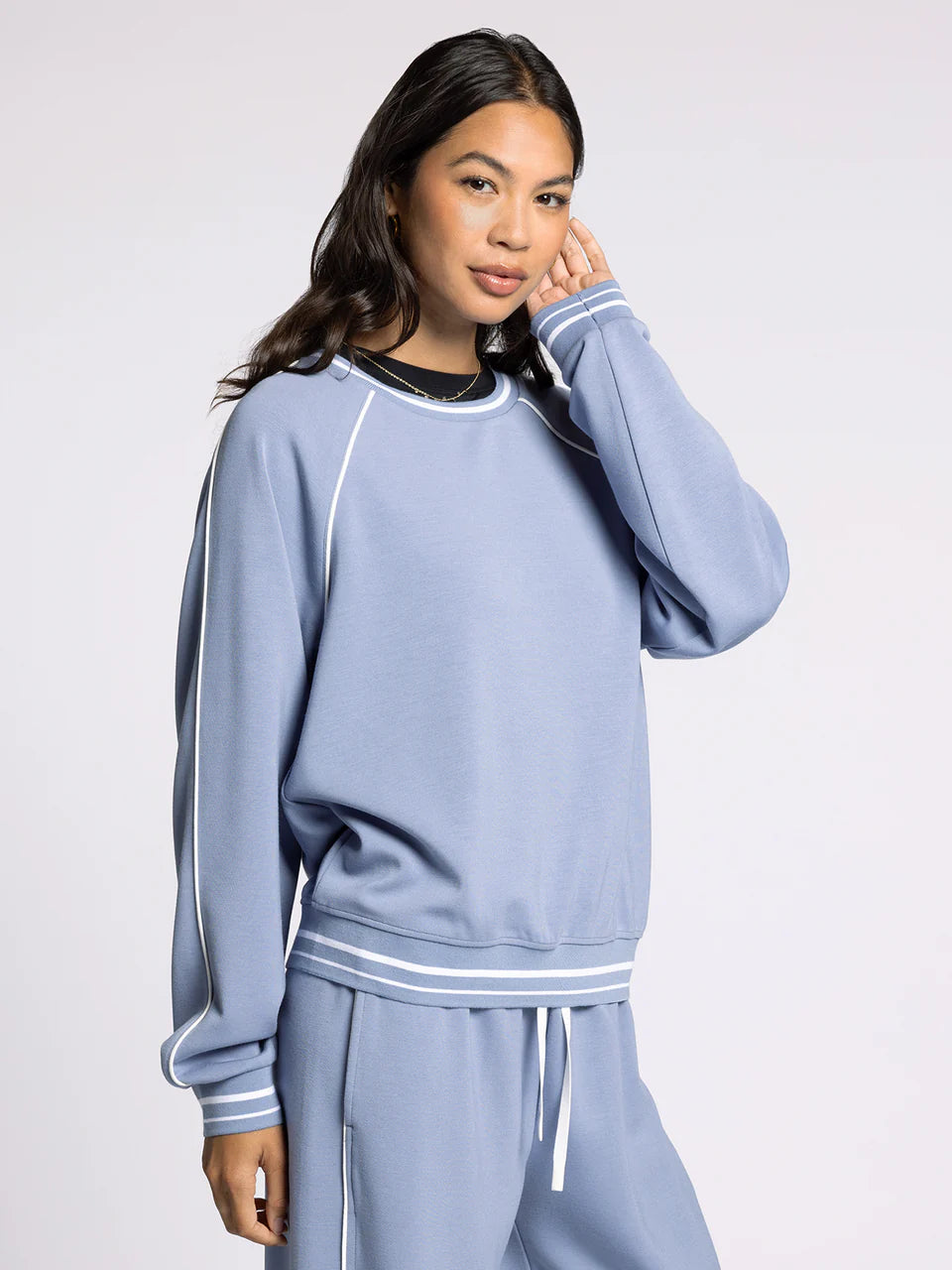 light blue crewneck athletic top
