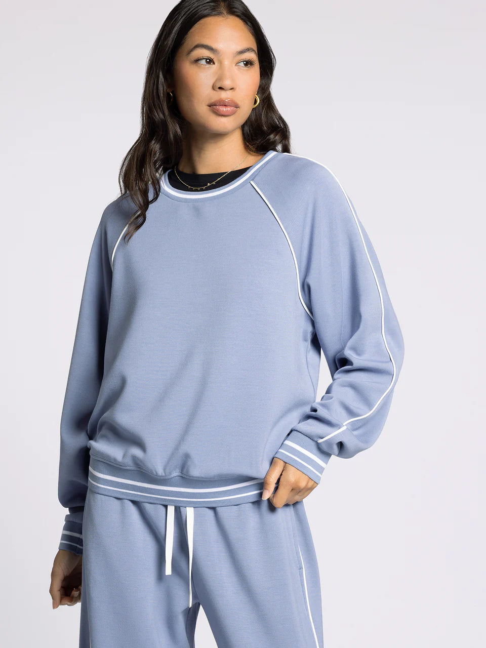 light blue crewneck athletic top