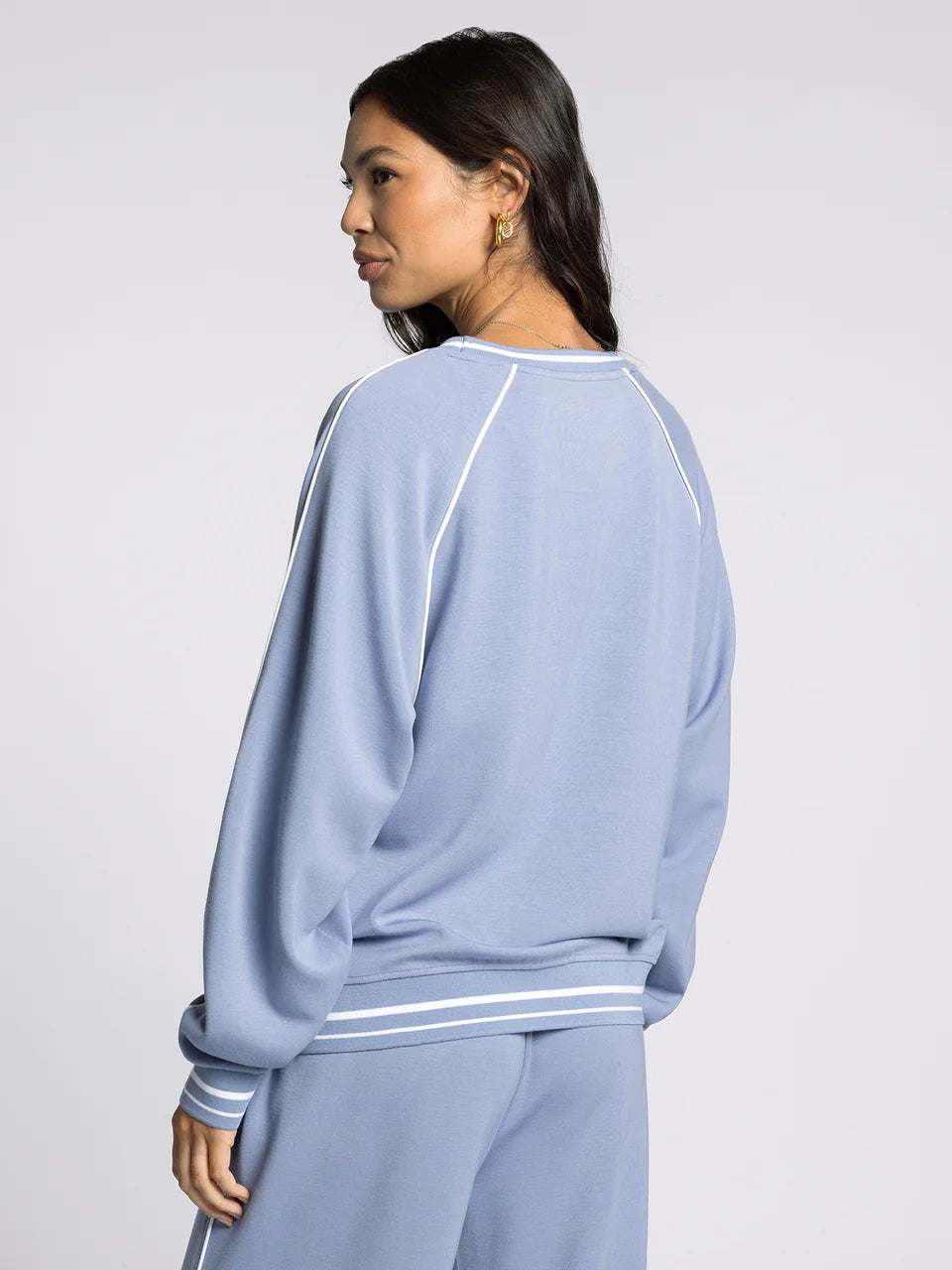 light blue crewneck athletic top