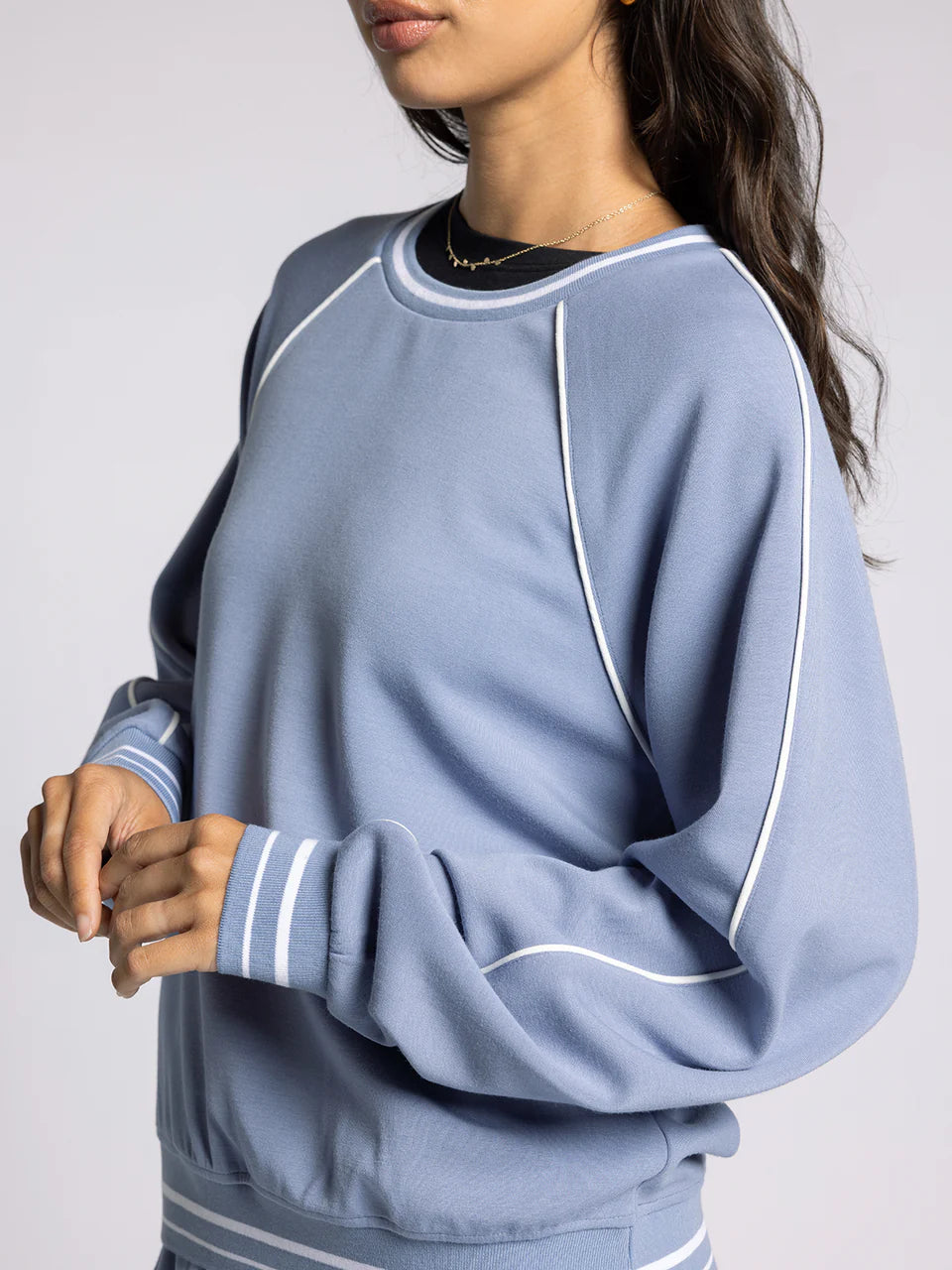 light blue crewneck athletic top