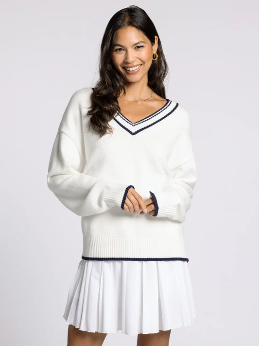 white v neck sweater with navy accents