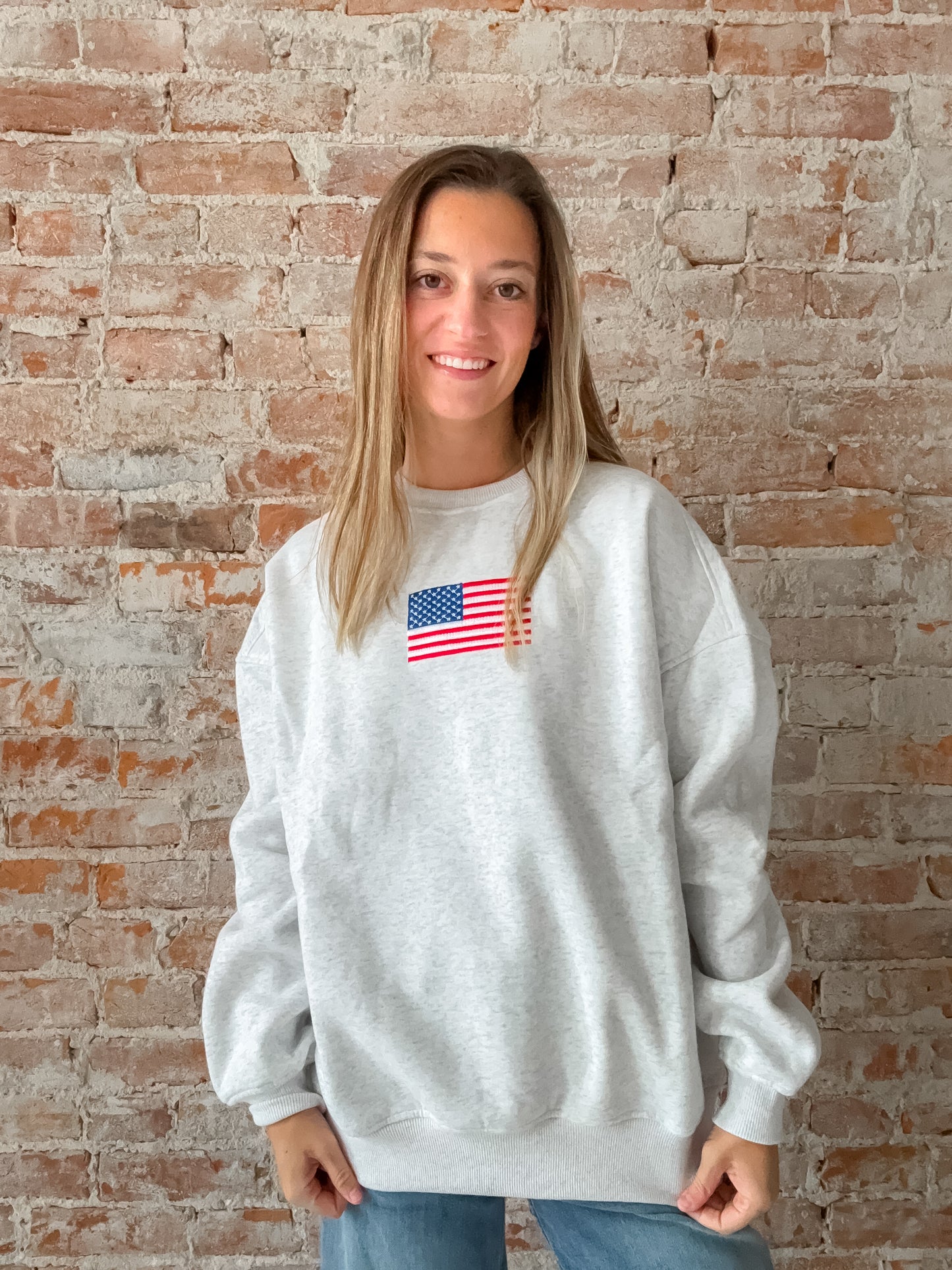 grey crewneck sweatshirt with embroidered american flag