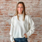 white mock neck sweater