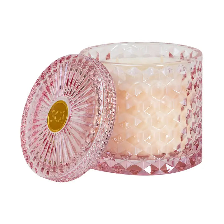 candle in pink glass jar

