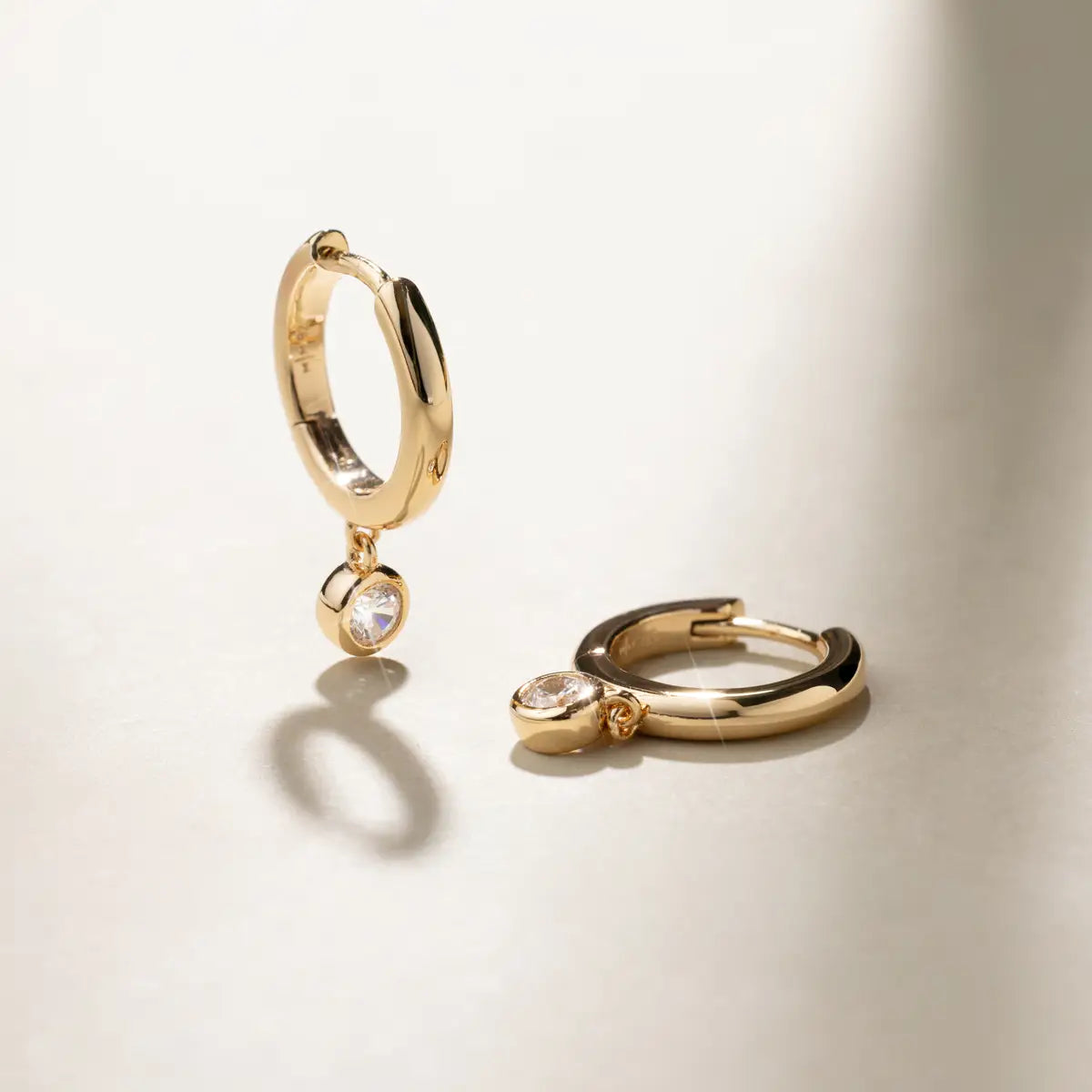 gold hoop with drop diamond