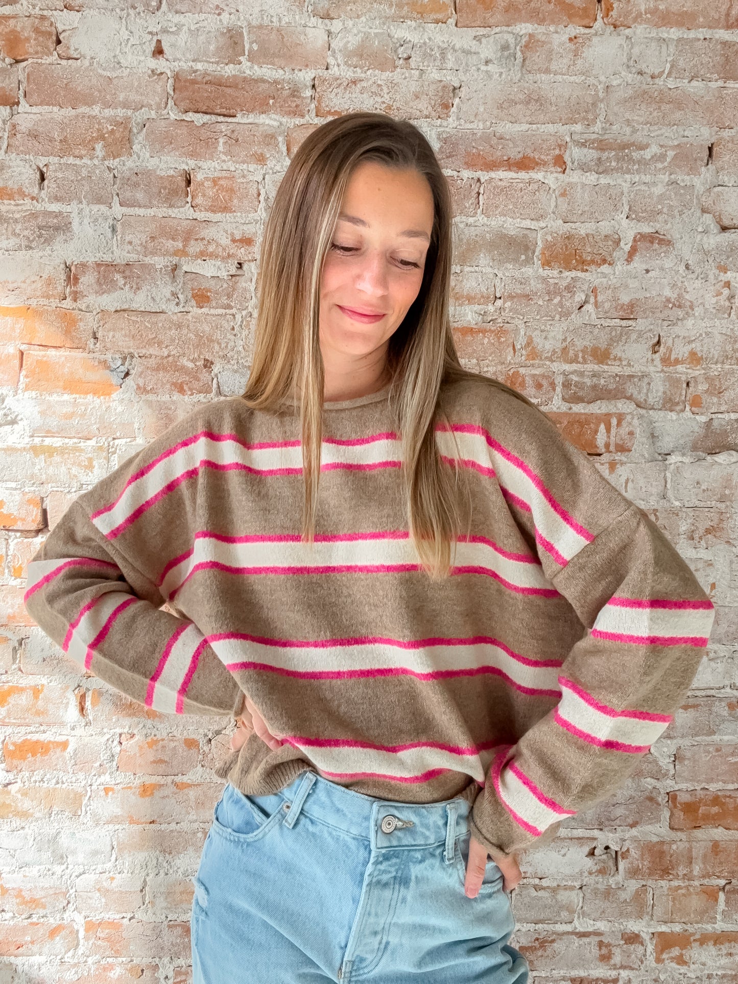 brown sweater with pink and white stripes