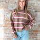 brown sweater with pink and white stripes